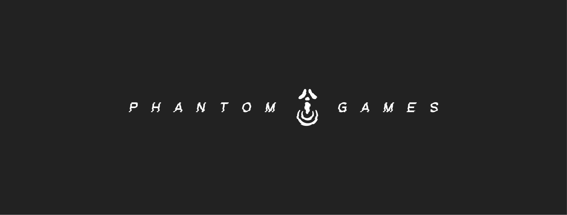 Gaming company logo that reads "Phantom Games" in white, with the company logo between the two words on a dark background
